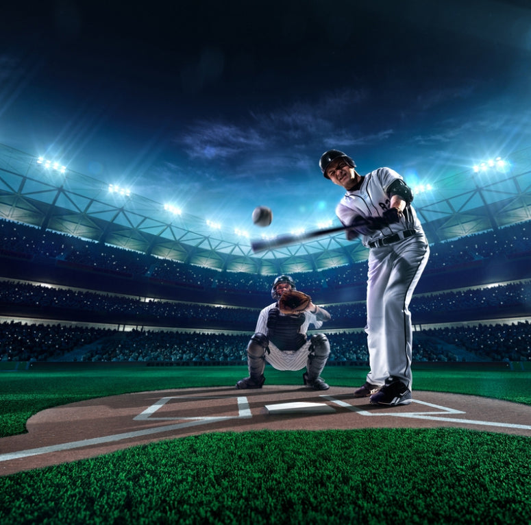 Baseball player has just hit ball; catcher crouched behind home plate. (licensed from ShotShop.com)
