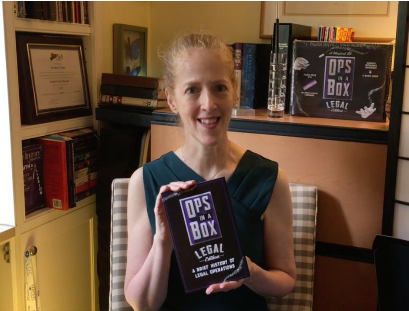 Author An Trotter sits holding piece she is reading