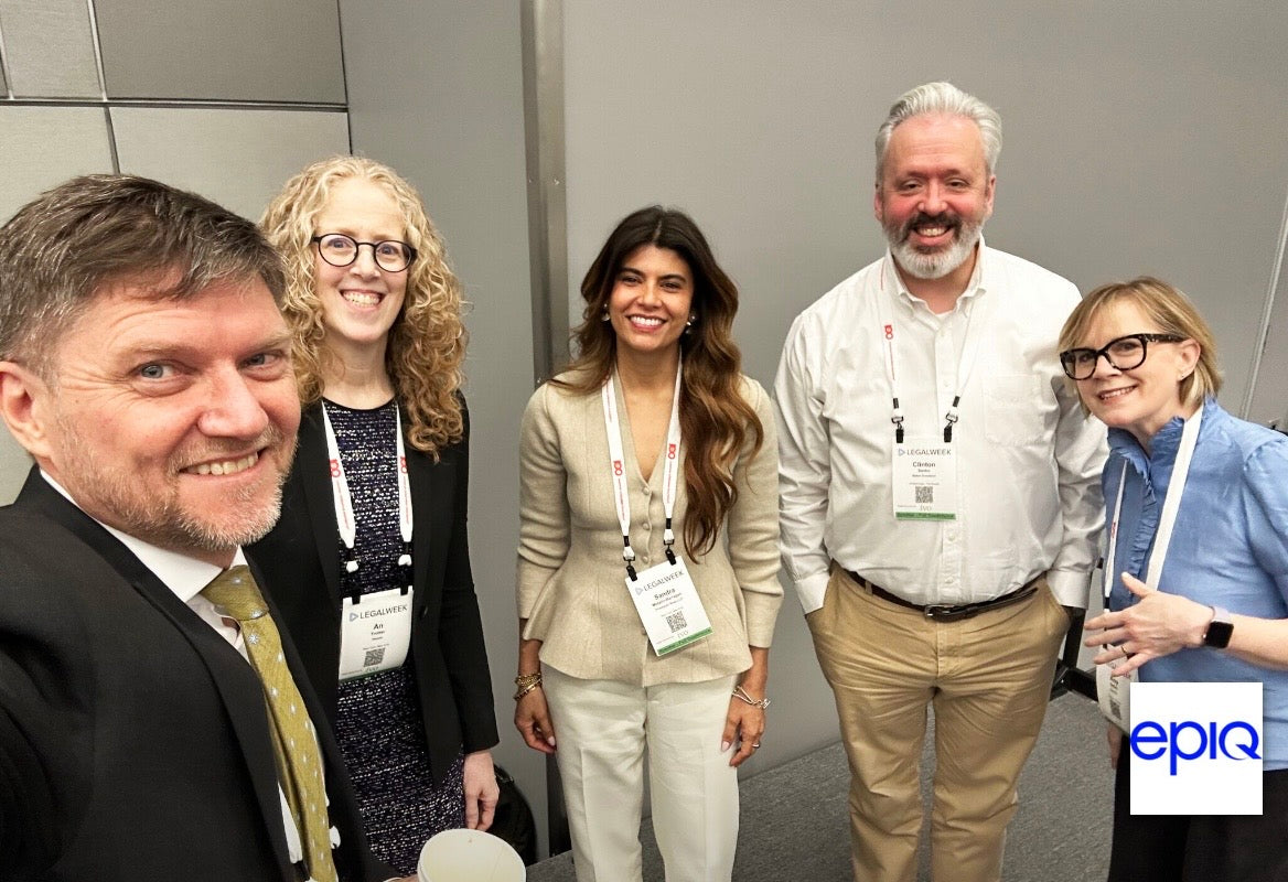 Moderator Jon Lavinder takes a group selfie with the panelists