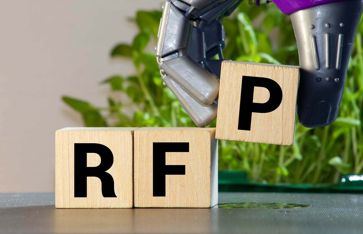 2 blocks reading R and F with robotic hand placing 3rd reading P (licensed from Adobe Stock Images)